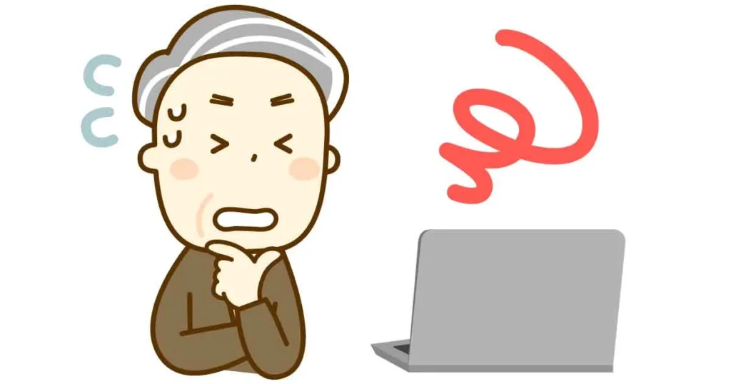 パソコンの前で焦っている高齢者のイラスト