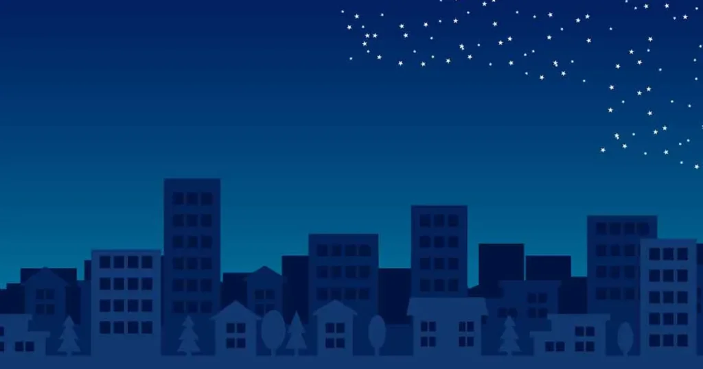 真っ暗で静まりかえった街に、星だけが少し輝いているイラスト